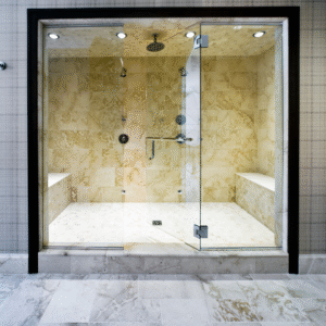 Large shower with earth tone tiles and seating area.