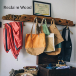 Wood hanging rack. Bags and scarf hanging as well as a suitcase.
