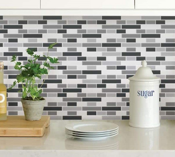 Peel and stick black, white and gray backsplash in a updated kitchen.