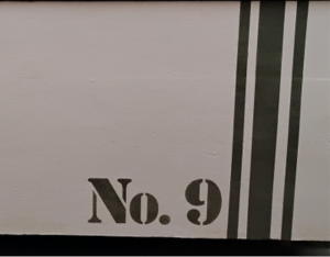 Olive green stripes, No,9 on white trunk.