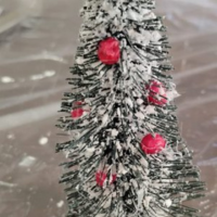 Berries added to small Christmas tree.