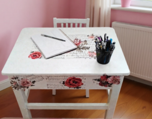 White desk with floral furniture transfer.