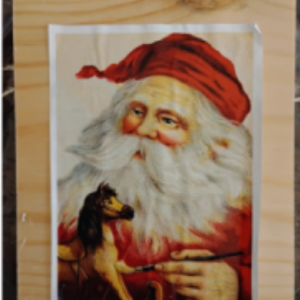 Decoupage Santa tissue to wood.