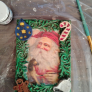 Ornaments, garland mold on the Santa wood block.