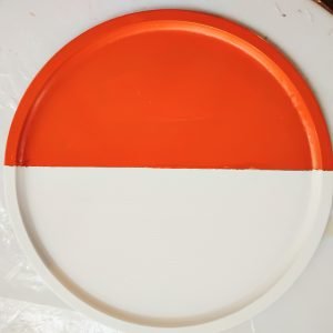 Pan painted half autumn orange and half white