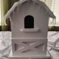 White birdhouse with icicles