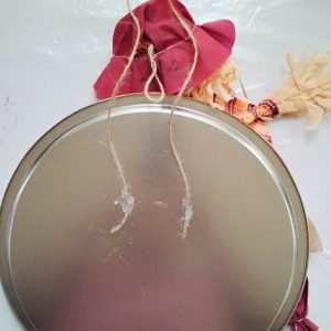 Hot glue twine to the back of the pan