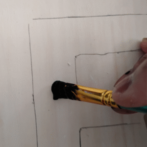 Painting the letters black.