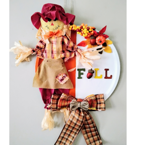 Scarecrow pizza hung on the wall.