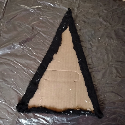 Triangle cardboard and fabric.