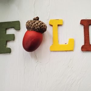 The word fall with a acorn as the A