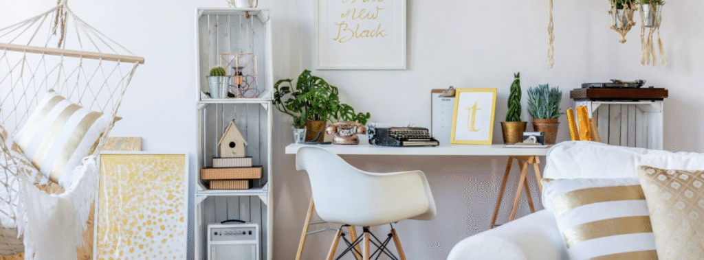 Desk, chair, bookcase in a white room.