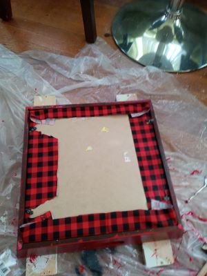 Red and black checker fabric glued to tray.