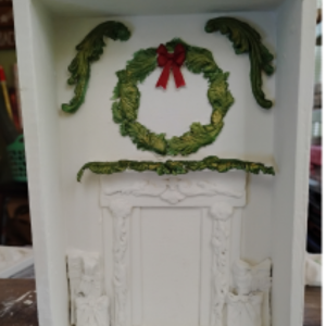 Wood box with fireplace and garland.