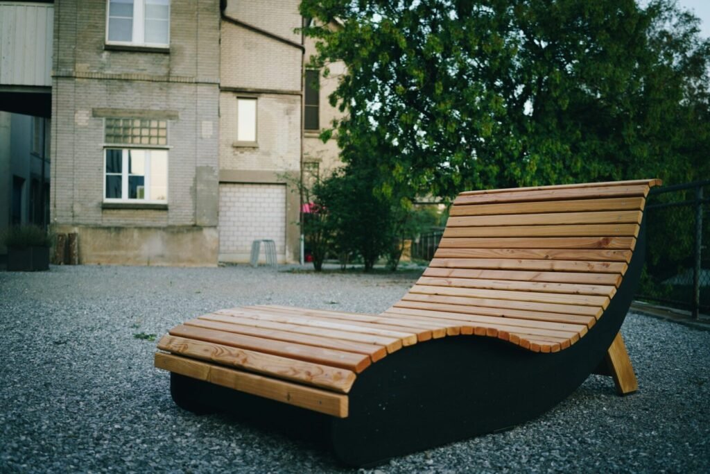 Restored outdoor chair,sitting in the yard.