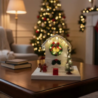 White birdhouse with Christmas decoration.