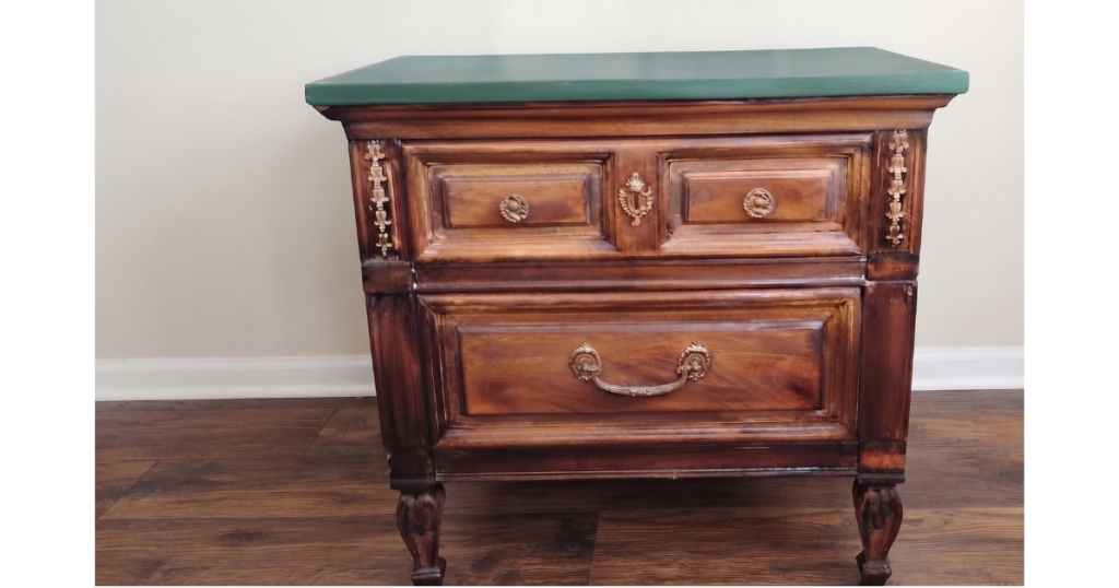 Brown solid wood end table, which a bluish top.